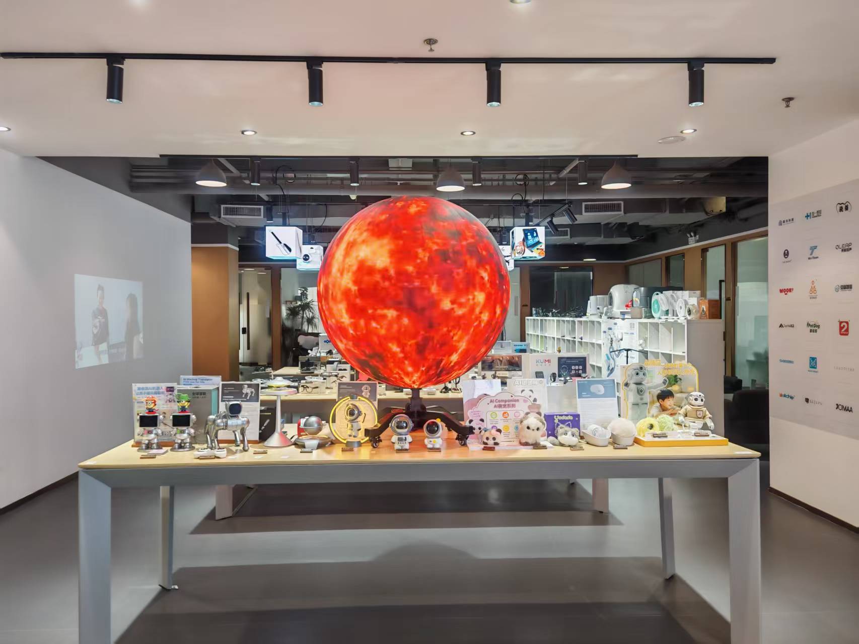 Illuminated globe installation and product display inside the showroom